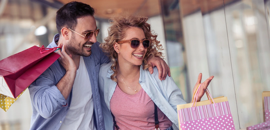 Happy couple shopping early for the holidays