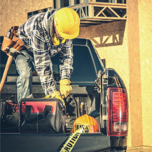 Man with tools in work truck